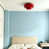 Pink tiered ceiling light shown against a plain white background