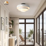 Sage green tiered ceiling light shown against a plain white background