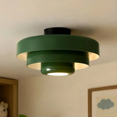 Close view of the layered iron shades on the tiered ceiling light