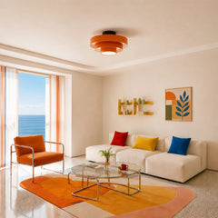 Underside of the ceiling light showing the glowing central drum diffuser