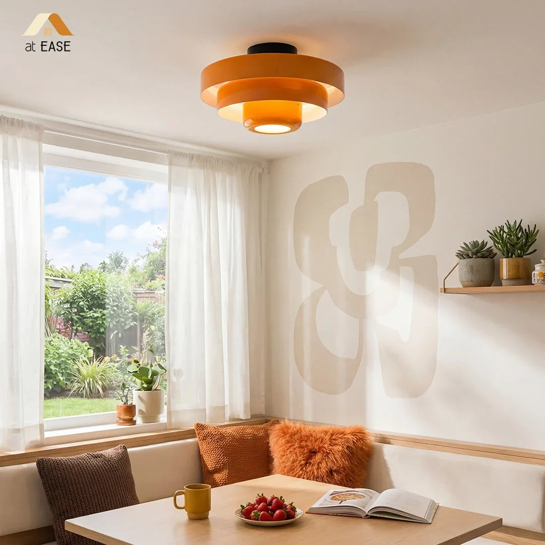 White tiered ceiling light shown flush against a white ceiling
