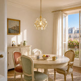 Transparent engraving glass petal pendant light on a clean studio backdrop