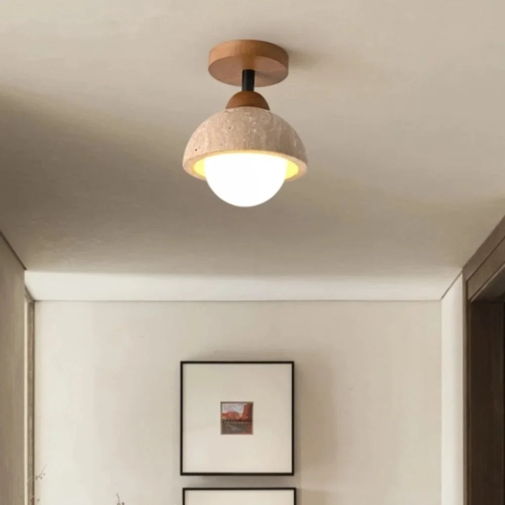 Travertine ceiling light detail of the opal glass globe