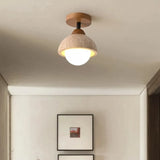 Travertine ceiling light detail of the opal glass globe