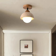 Travertine ceiling light detail of the opal glass globe