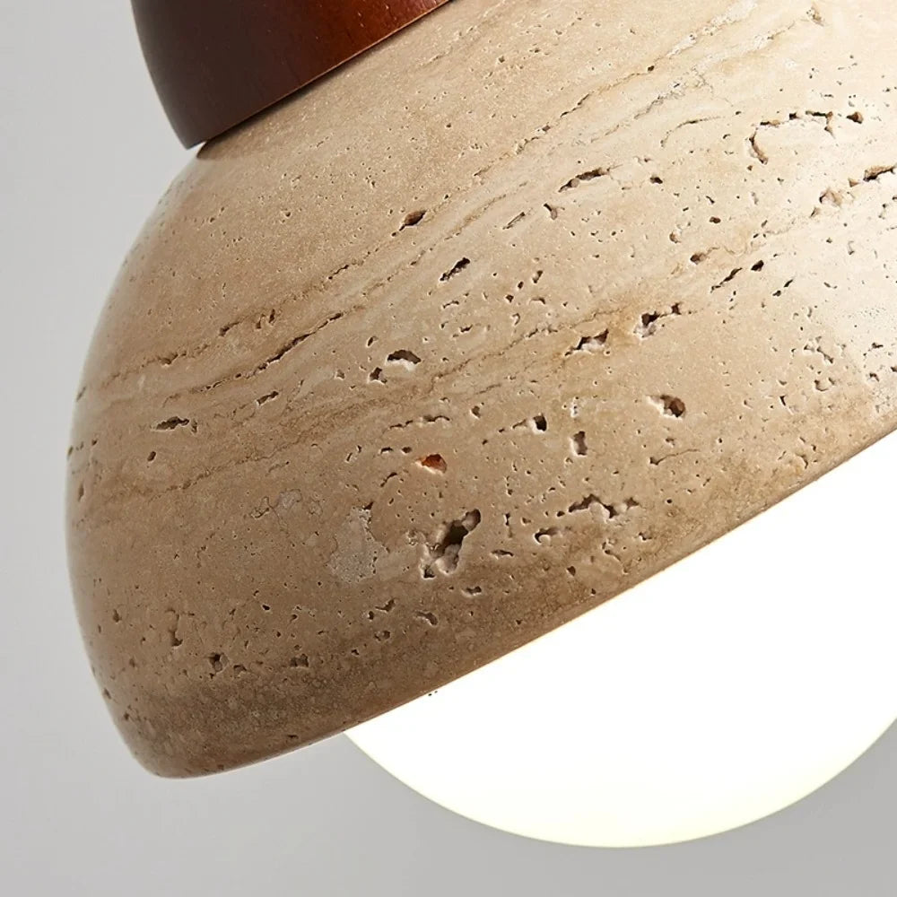 Travertine ceiling light with warm glass glow detail