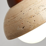 Travertine ceiling light with warm glass glow detail