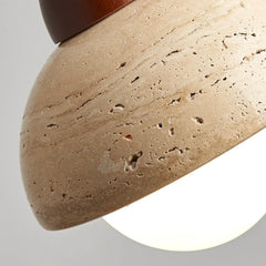 Travertine ceiling light with warm glass glow detail