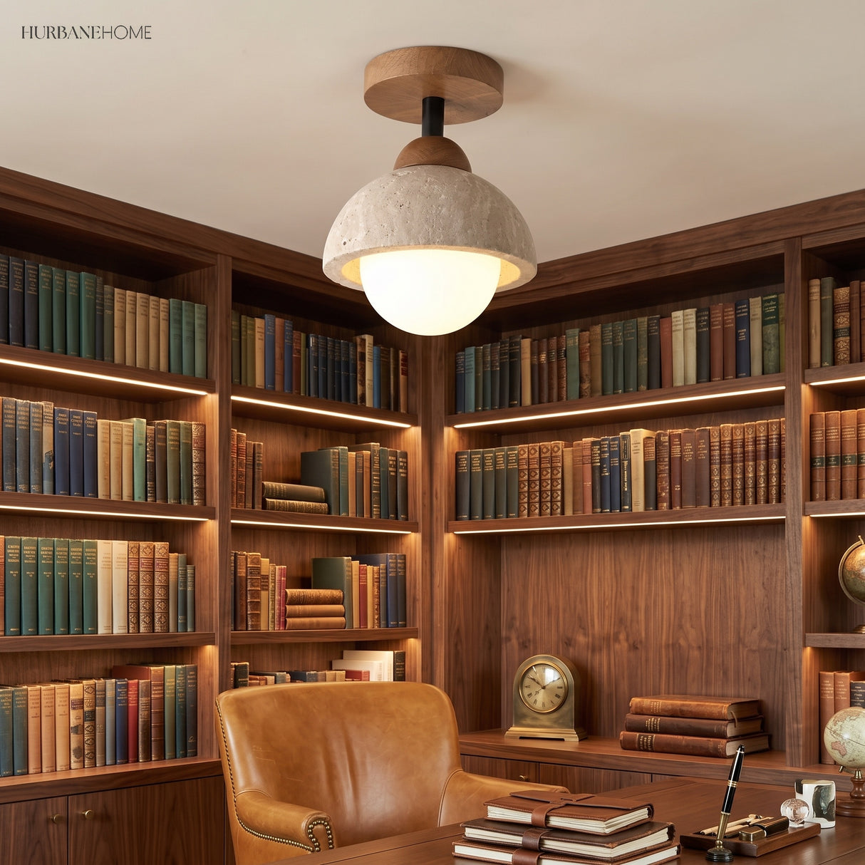 Stone dome semi flush ceiling light over a study with lit bookshelves