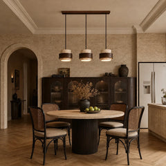 Beige stone pendant light, three-head round plate, over a dining room table