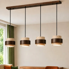 Beige travertine pendant light, four heads, over a living room seating area