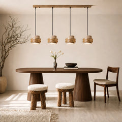 Beige travertine pendant light, four heads, above an oval dining table