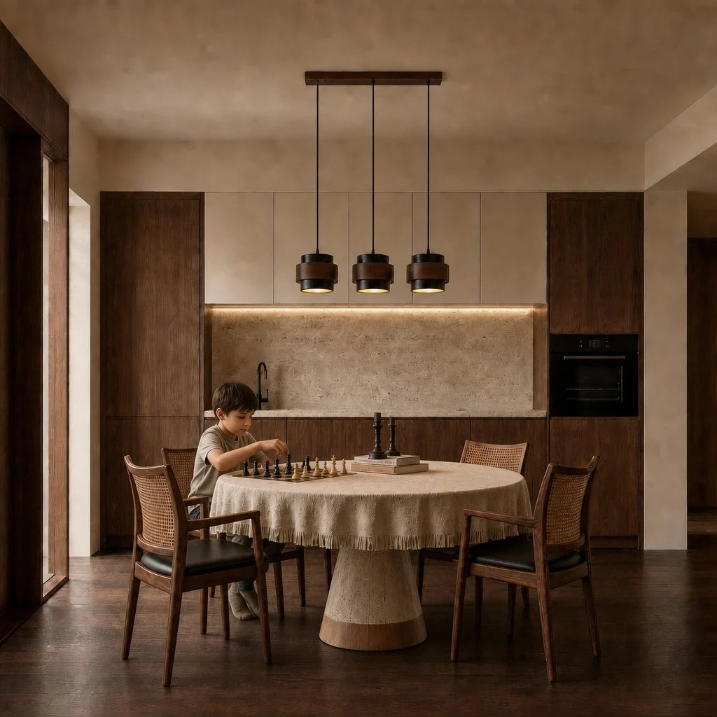 Black travertine pendant light, three heads, over a kitchen worktop