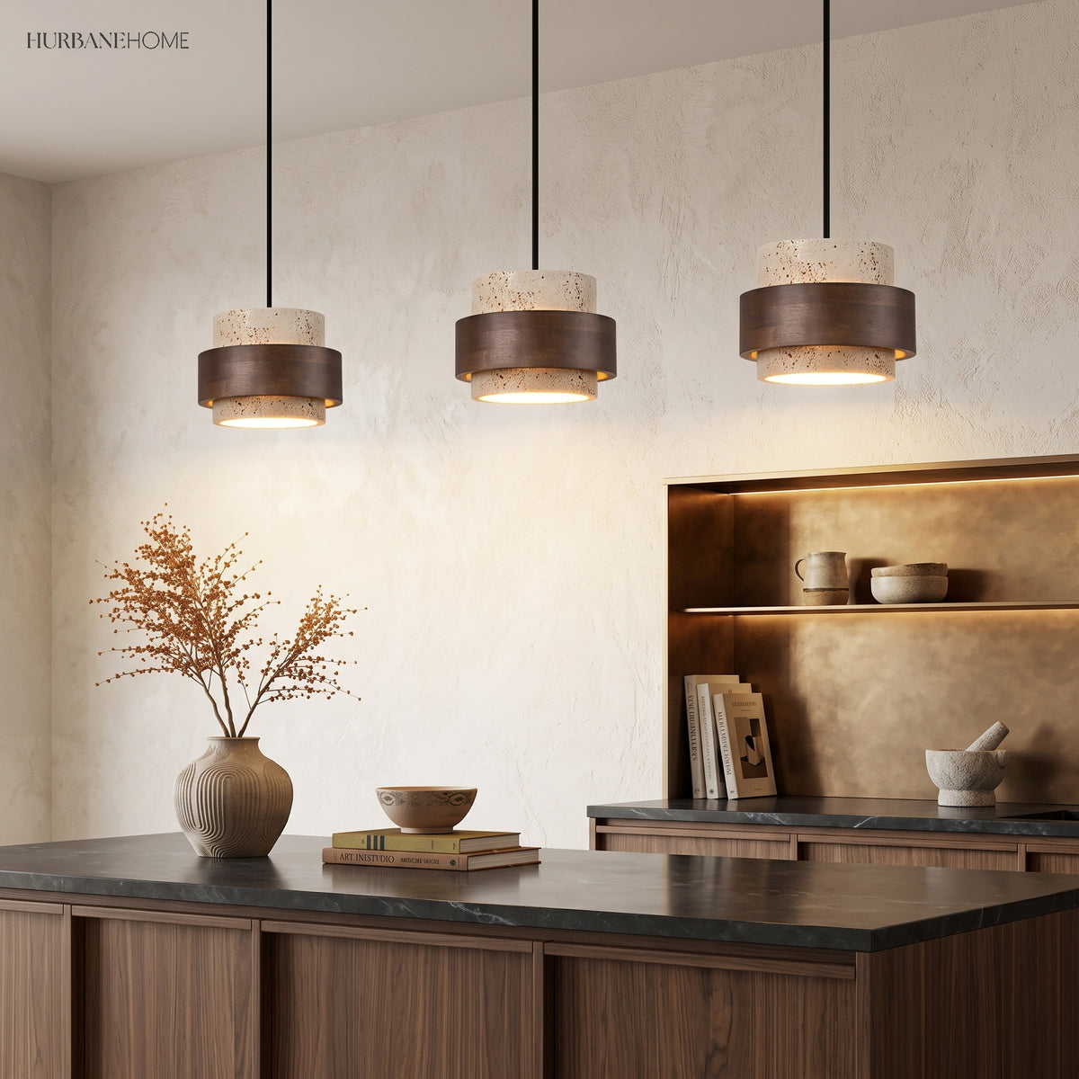 Three travertine and wood pendant lights in a row over a kitchen counter