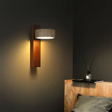 Travertine wall sconce set to cast a warm ambient glow in a styled room