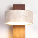 Closeup of the natural travertine shade showing its pitted stone grain and texture