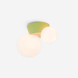 Studio view of the green fluted canopy holding two opal glass globes