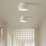 Two-tier semi flush ceiling light shown at a three-quarter angle on a plain backdrop