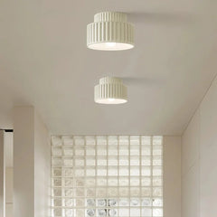 Two-tier semi flush ceiling light shown at a three-quarter angle on a plain backdrop