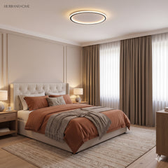 Ultra thin ceiling light above a bed in a warm toned bedroom