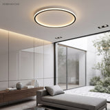 Ultra thin ceiling light in a glazed lounge with courtyard view