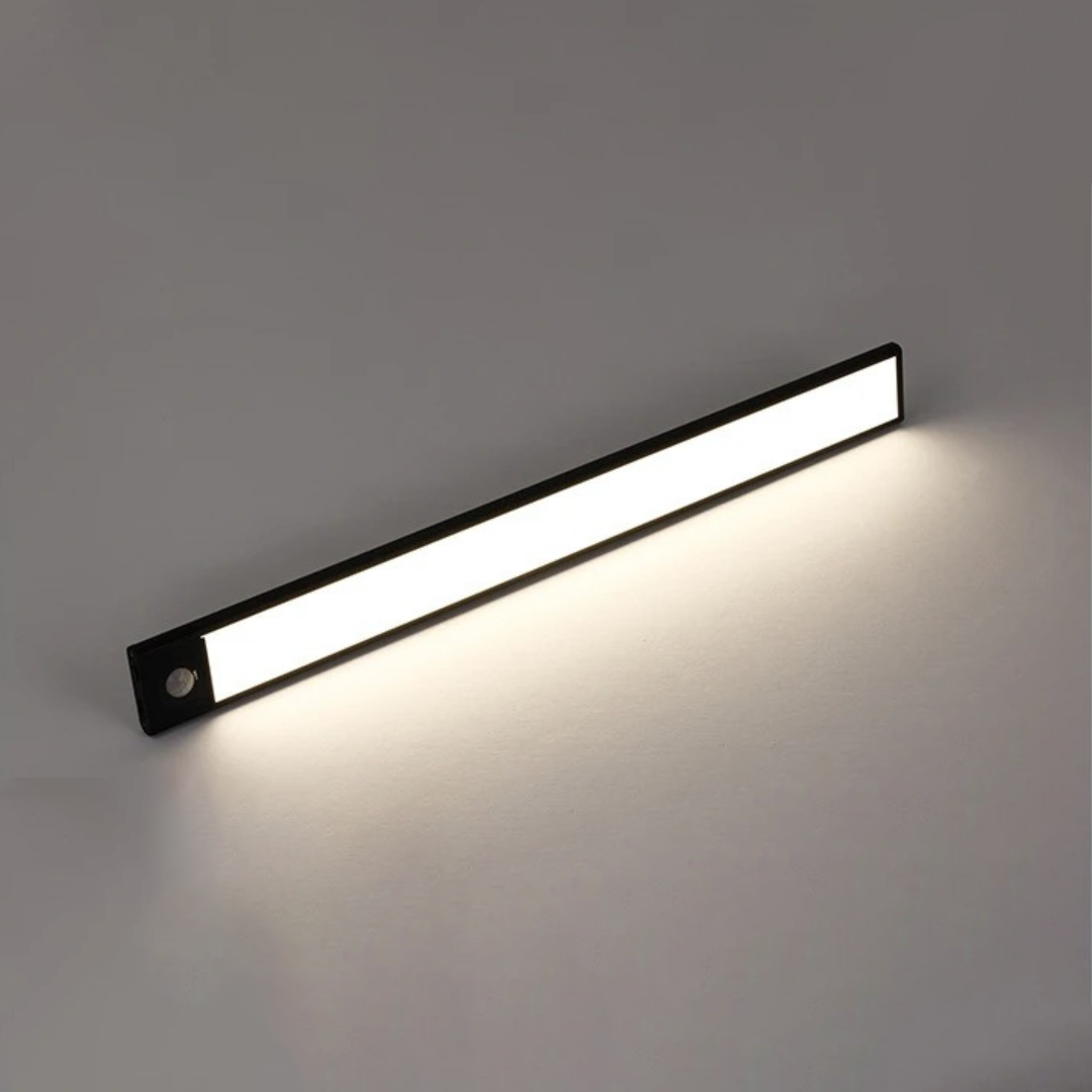 Angled view of the black light bar with a warm white glow
