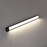 Angled view of the black light bar with a warm white glow