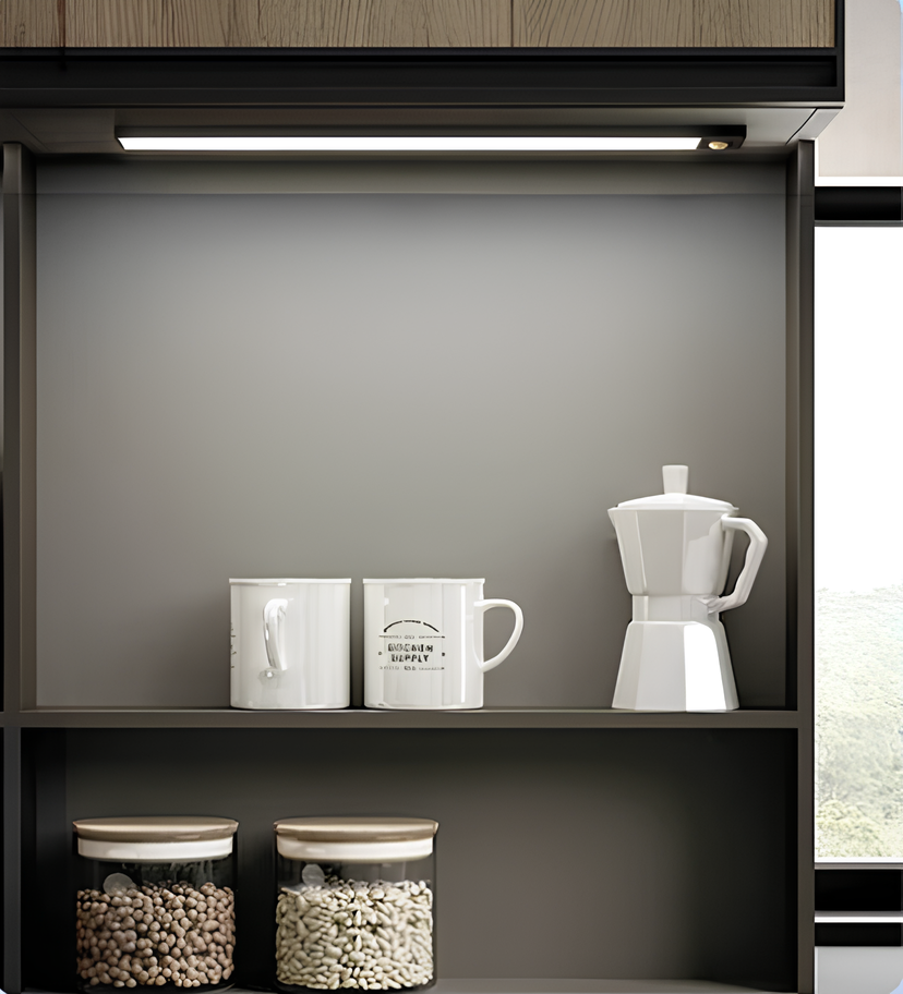 Under cabinet bar lighting cups and storage jars on a dark shelf