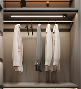 Two light bars fitted inside a wardrobe above hanging shirts