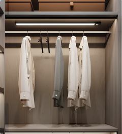 Two light bars fitted inside a wardrobe above hanging shirts