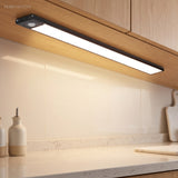 Under cabinet light bar washing a stone worktop with warm white light