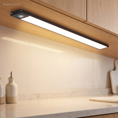 Under cabinet light bar washing a stone worktop with warm white light