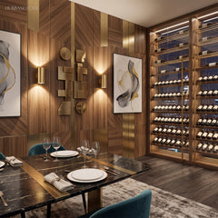 Two gold up and down sconces lit on a panelled dining room wall