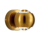 Close view of the gold orb sconce showing the split dome and open ends