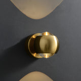 Gold orb sconce with 12.5 cm height and 10 cm width measurements marked