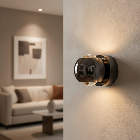 Black orb sconce shown from the side with height and width marked
