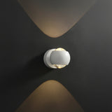 White orb sconce with height and width measurements marked