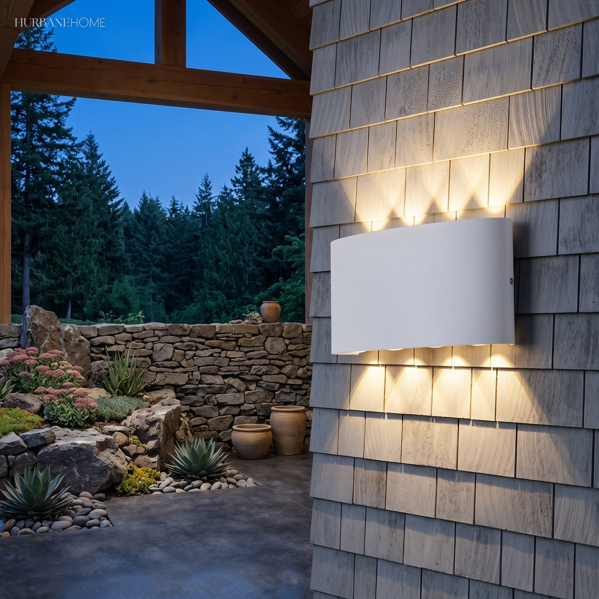 Curved white wall light casting fanned beams across timber shingle cladding