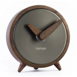 Vintage brass table clock on modern office desk