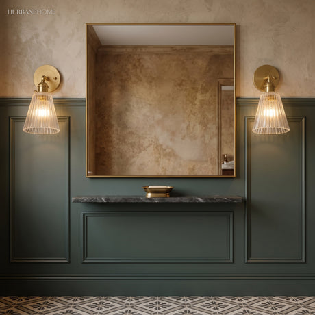 Pair of ribbed glass sconces flanking a mirror above a green vanity
