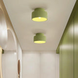 Vintage ceiling light fixture close up on the ribbed lower drum of the shade