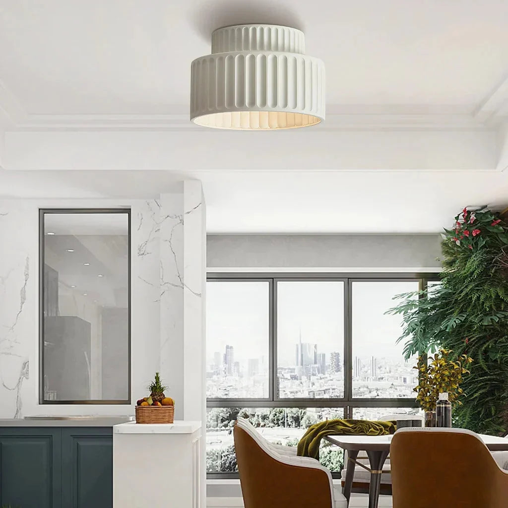 Vintage fluted ceiling light lit up showing warm glow through the resin shade