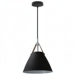 Vintage industrial metal pendant light in hotel room setting