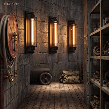 Three cage wall sconces lit along a rough stone corridor wall