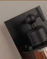 Close view of the black pipe joint and ball fitting at the top