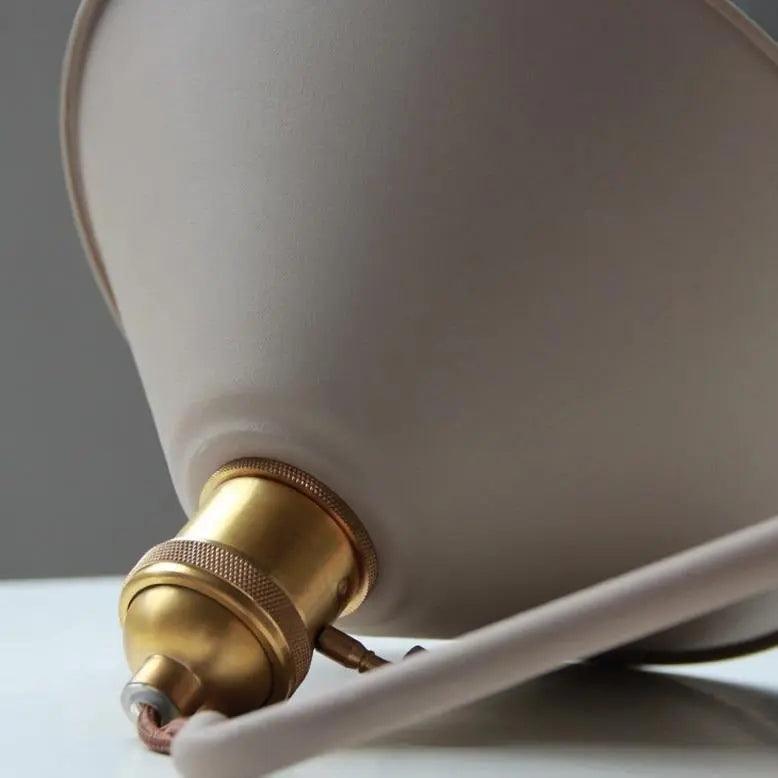 Close view of the cone shade and the brass socket joint