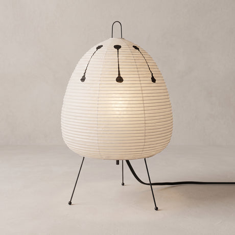 Rice paper table lamp with egg shaped shade on wire tripod legs