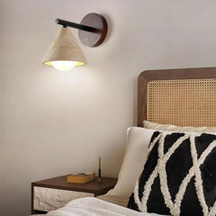 Wabi-sabi stone wall light with black metal arm