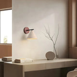 Wabi-sabi travertine wall light glowing in a calm interior