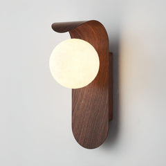 Wall sconce glowing to show even glare free frosted glass light